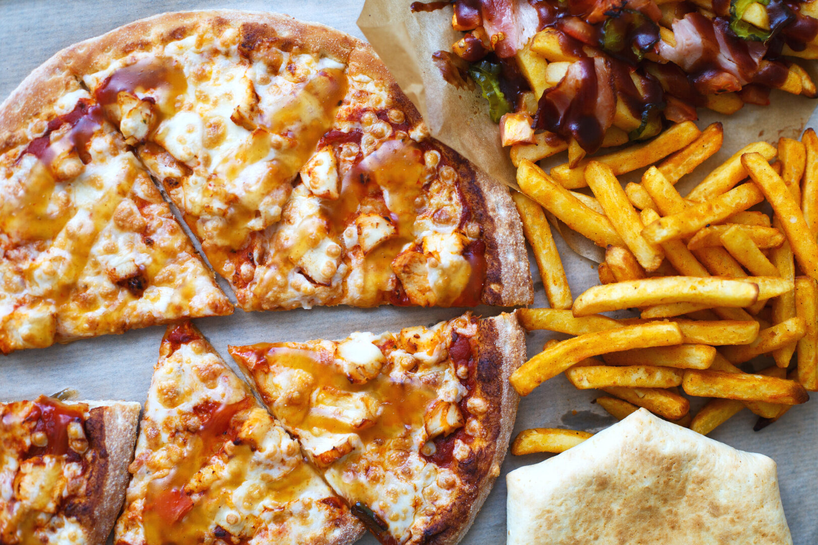 Unhealthy concept. Fast Food - Pizza, Fried Potato. Close up. Popular fast food recipes